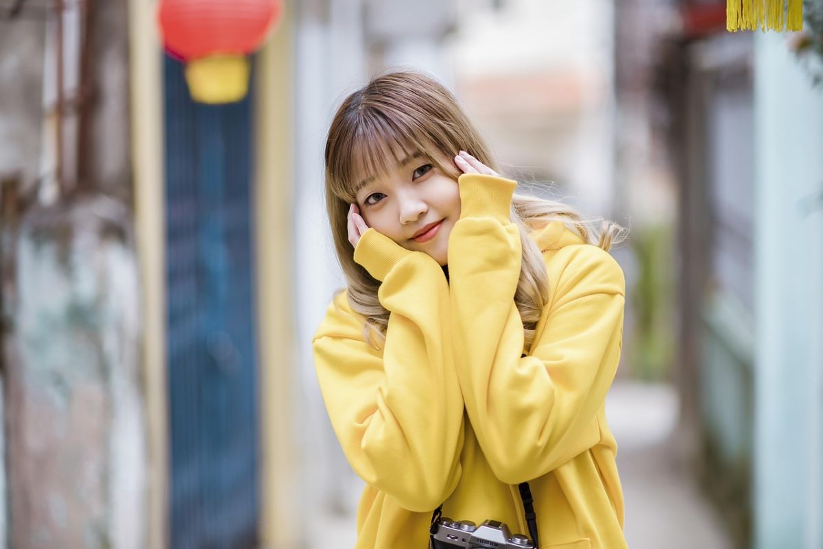 girl in yellow hoodie
